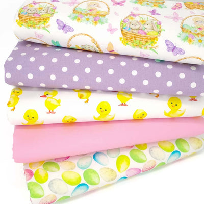 A bundle of five easter themed cotton fabrics including easter baskets, chicks and eggs.