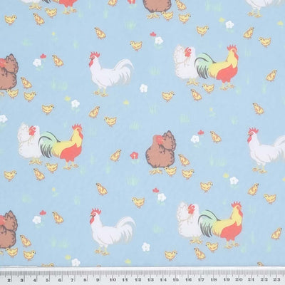 Rooster, hens and chicks complete the chicken family in this classic spring time design. Printed on a pastel sky blue, quality polycotton fabric with a cm ruler
