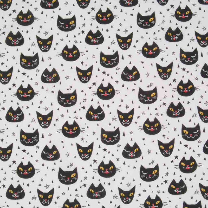 Winking black Halloween cats printed on a white polycotton fabric