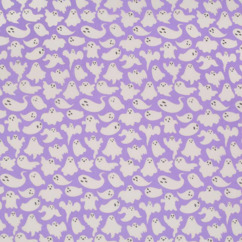 Small white halloween ghosts printed on a lilac polycotton fabric
