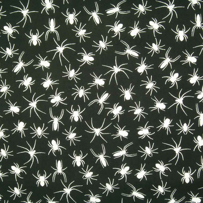 White spiders printed on a black polycotton halloween fabric