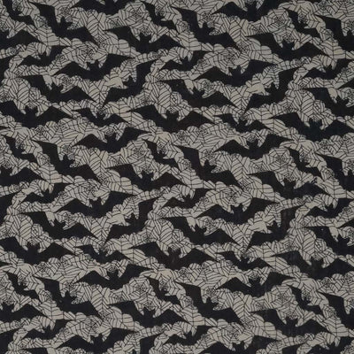Flying black bats printed on a silvery grey polycotton.