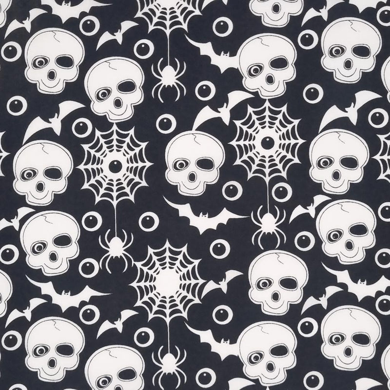 Skulls, eyeballs and bats printed on a black halloween polycotton fabric