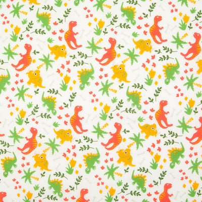 Orange and green dinosaurs are printed on a fat quarter of white polycotton fabric