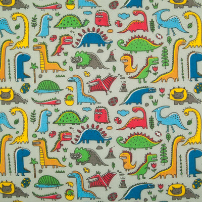 colourful cartoon dinosaurs printed on a silver polycotton fabric