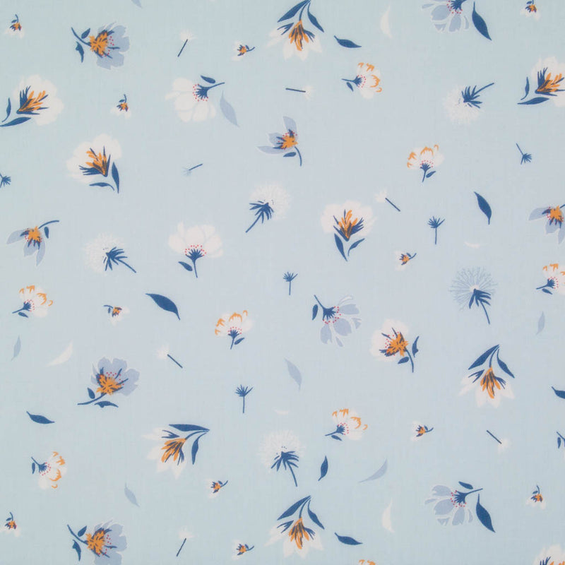 Pretty dandelions are printed on a sky blue polycotton fabric