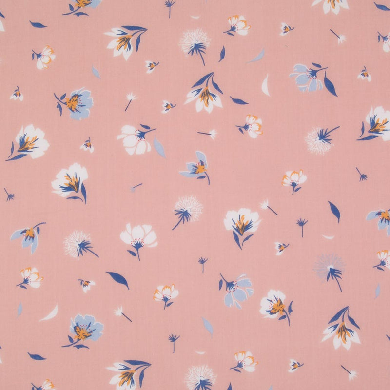 Pretty dandelions are printed on a pastel pink polycotton fabric