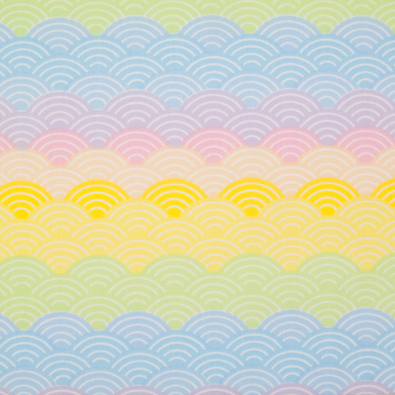 Pastel coloured rainbow arches printed on a fat quarter of polycotton fabric