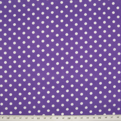 Spots on purple polycotton fabric