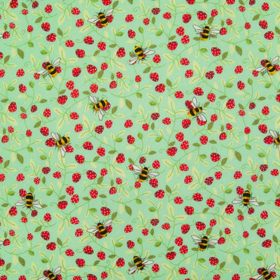 Small red strawberries and yellow bees are printed on a meadow green cotton poplin fabric by Rose & Hubble