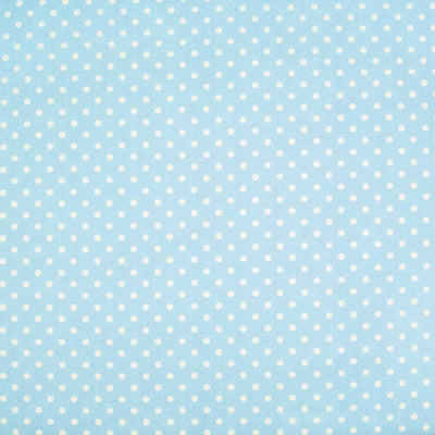 Small white spots are printed on a light powder blue cotton poplin by Rose & Hubble