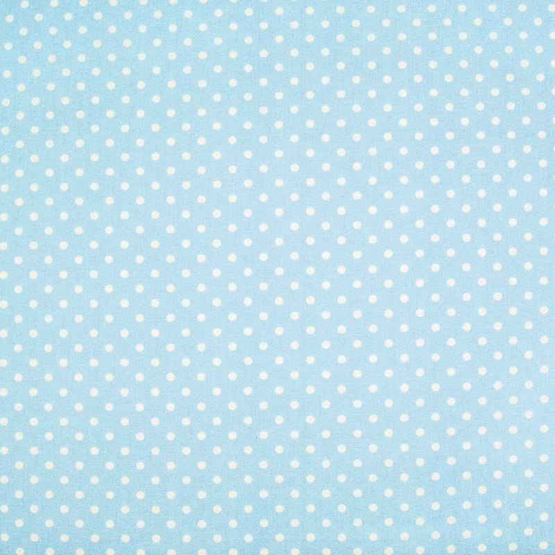 Small white spots are printed on a light powder blue cotton poplin by Rose & Hubble