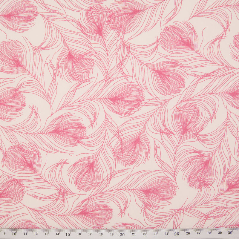 This Rose & Hubble fabric features a pretty rose pink feather print on a cream cotton poplin with ruler for size perspective