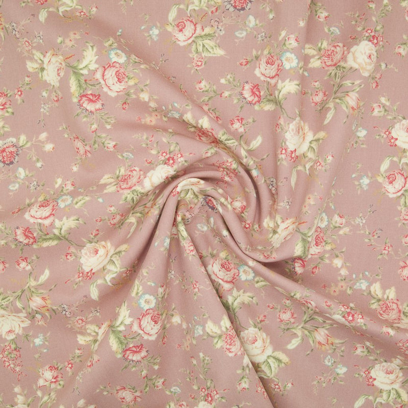 A floral pattern of pink and pale roses on a  cotton poplin fabric with a swirl in the middle for drape perspective