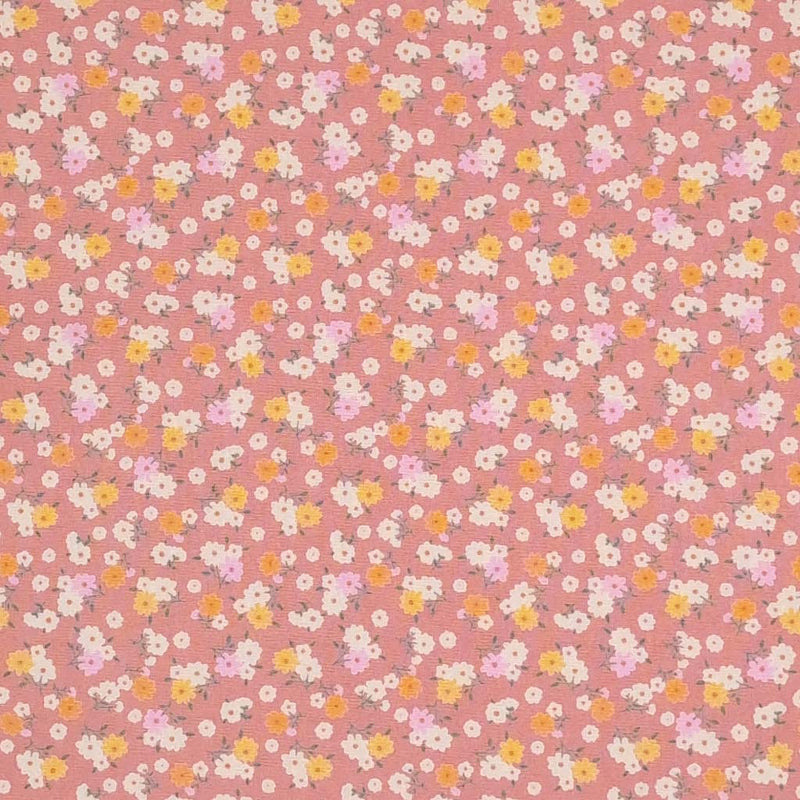 Tiny bunches of pink, orange and white flowers on a dusky pink Rose and Hubble cotton poplin fabric