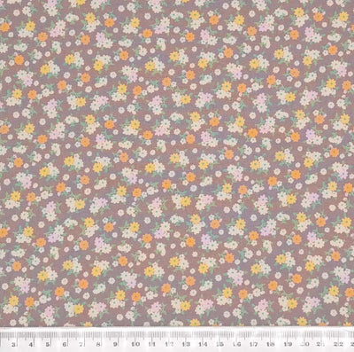 Tiny bunches of pink, orange and white flowers on a taupe Rose and Hubble cotton poplin fabric with a cm ruler