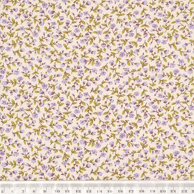 Tiny lilac flowers printed on a Rose & Hubble cotton poplin fabric with a cm ruler
