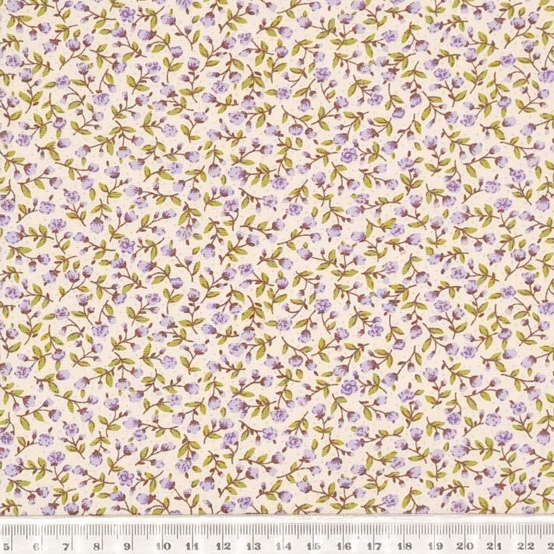 Tiny lilac flowers printed on a cotton poplin fabric