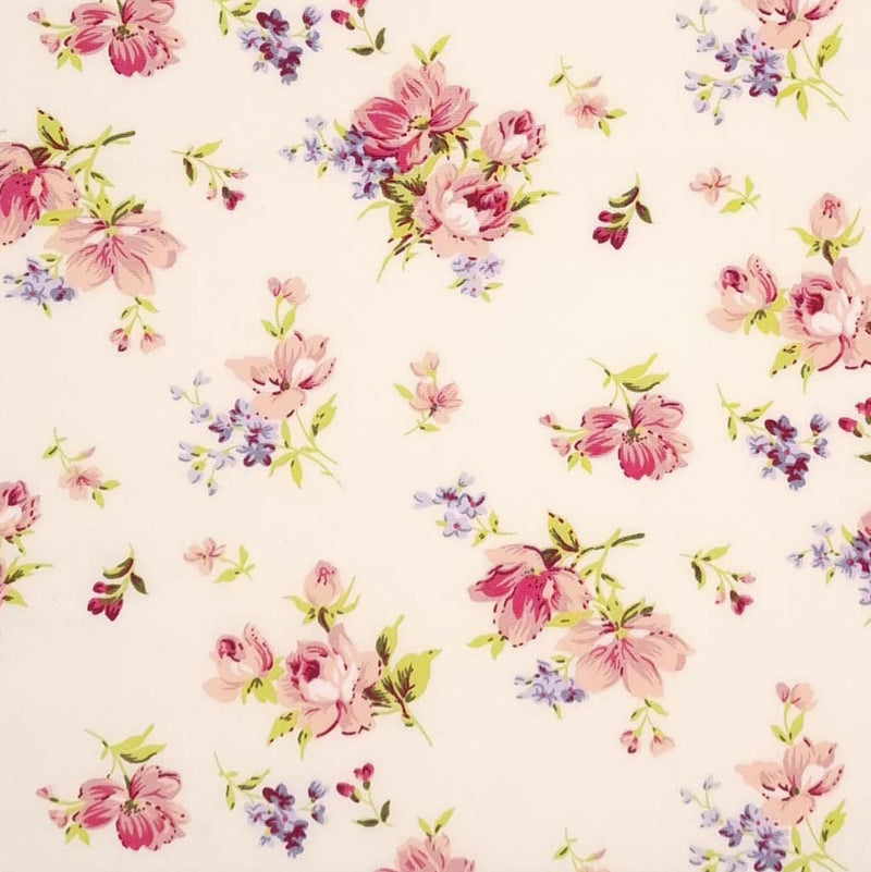 A delicate floral design on a cream cotton poplin fabric