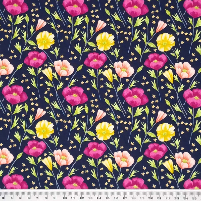 Pretty deep cerise poppies and yellow crocus are printed on a navy cotton poplin fabric by Rose & Hubble with a cm ruler