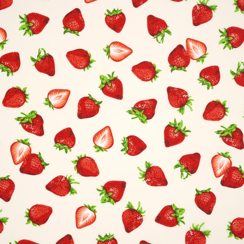 Juicy red strawberries printed on a cream cotton poplin fabric by Rose & Hubble