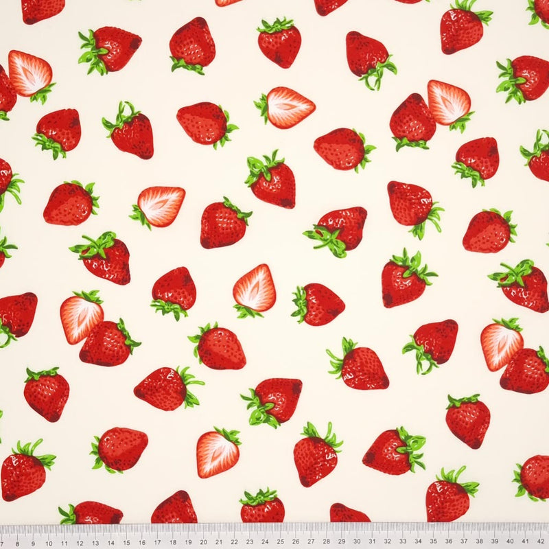 Juicy red strawberries on a cream fabric