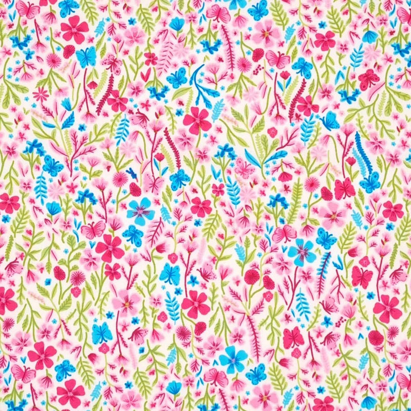 A Rose & Hubble floral design featuring vibrantly coloured ditsy flowers on an ivory, 100% cotton poplin fabric.