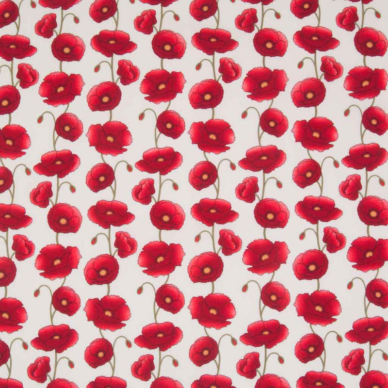 Columns of pretty red poppies are printed on an ivory cotton poplin fabric