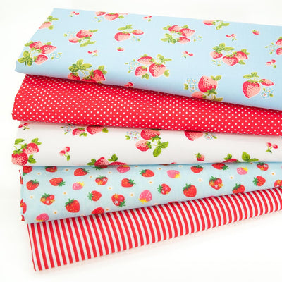 A fat quarter bundle with  strawberries and candy stripes in red and sky blue