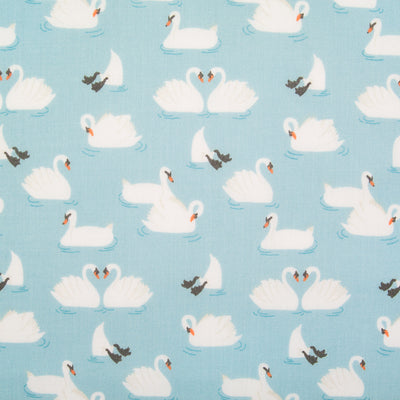 Swans printed on a blue polycotton fabric