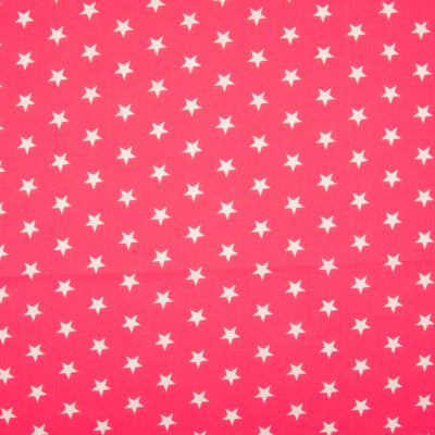 10mm white stars are printed on a cerise polycotton fabric