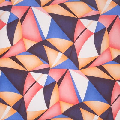 A bold and colourful geometric design in peach and blue tones, printed on a rayon fabric