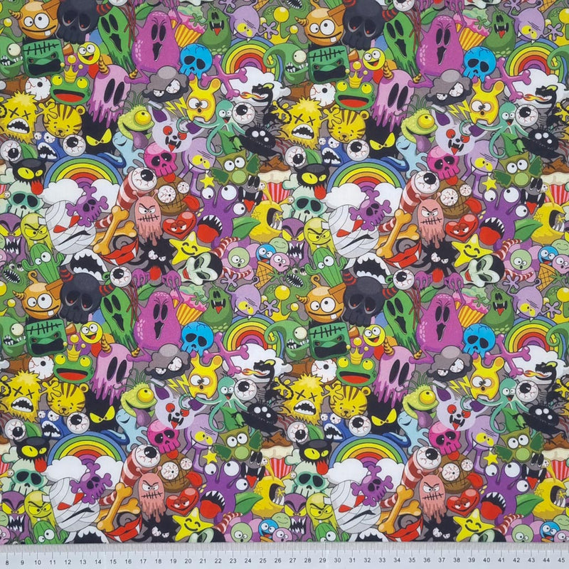 A colourful mash up of monsters printed on a 100% cotton fabric by Little Johnny with a cm ruler at the bottom