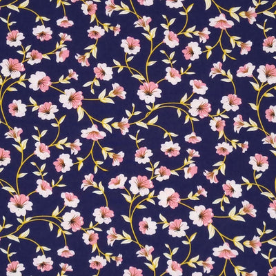A delicate pink floral with a golden vine, printed on a navy, lightweight cotton poplin fabric