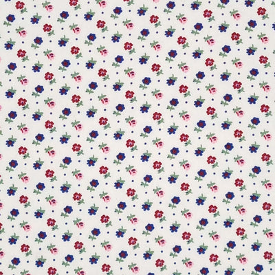 Tiny flowers in reds and navy printed on a white, lightweight cotton poplin fabric.