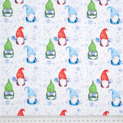 A beautiful print of festive gonks, surrounded by pale blue icy snowflakes on a quality white 100% cotton fabric with a cm ruler at the bottom
