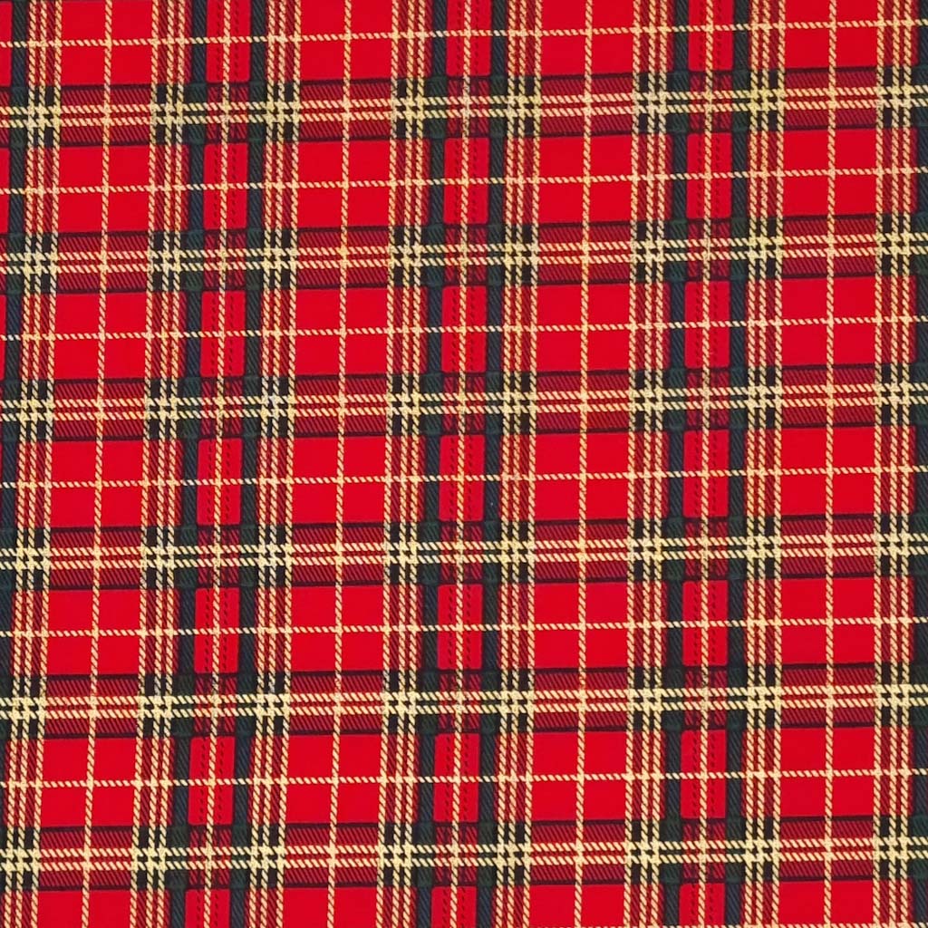 A medium sized gold lacquered and green tartan check on a red cotton fabric