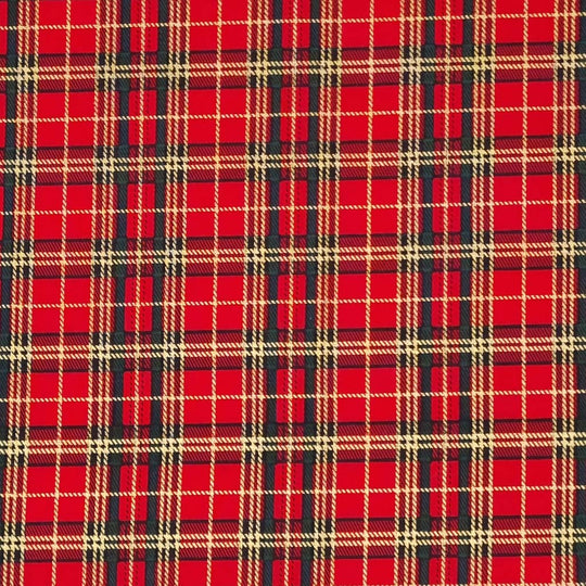 A medium sized gold lacquered and green tartan check on a red cotton fabric