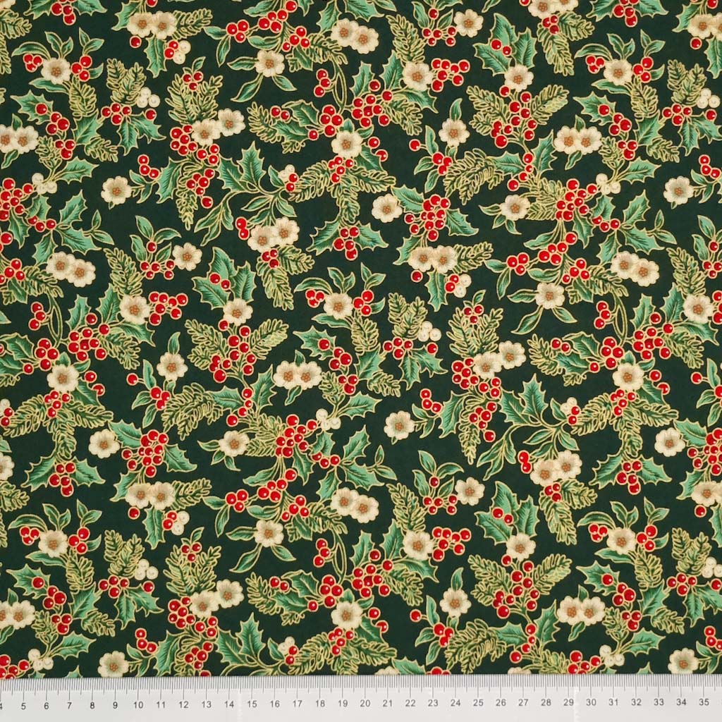 Printed holly berries, white flowers and pine branches are printed on this bottle green 100% cotton fabric with a cm ruler at the bottom