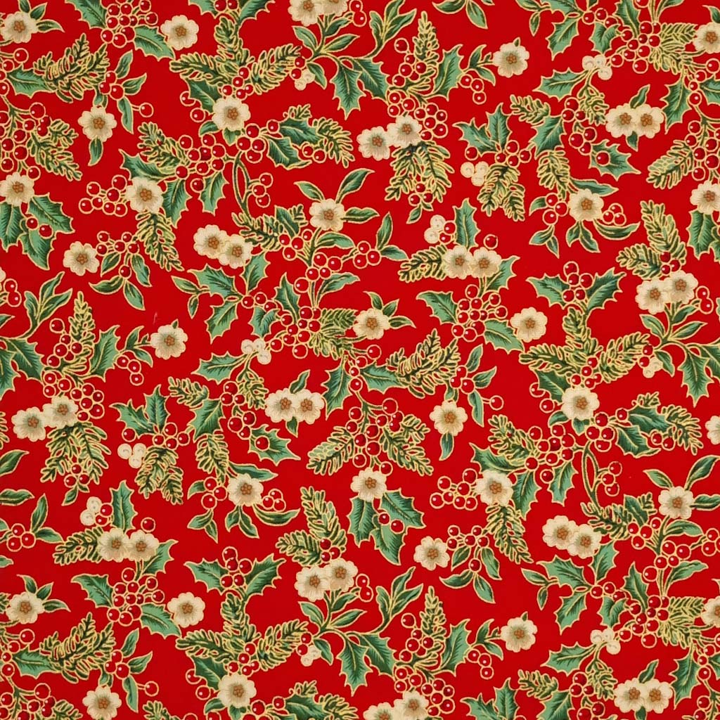 Printed holly berries, white flowers and pine branches are printed on this red 100% cotton fabric
