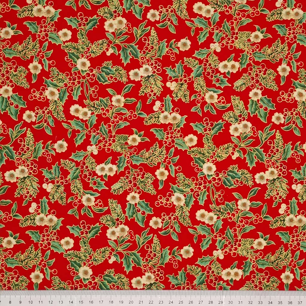 Printed holly berries, white flowers and pine branches are printed on this red 100% cotton fabric with a cm ruler at the bottom