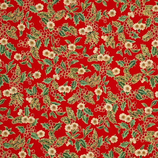 Printed holly berries, white flowers and pine branches are printed on this red 100% cotton fabric