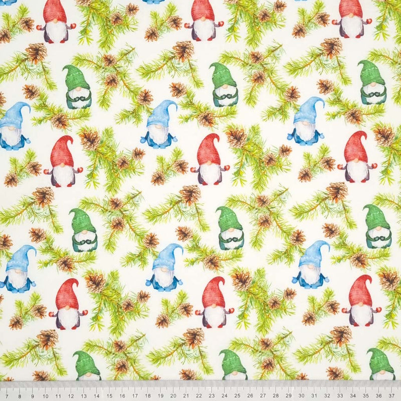 A beautiful print of festive gonks, pine leaves and cones on a quality white 100% cotton fabric with a cm ruler at the bottom