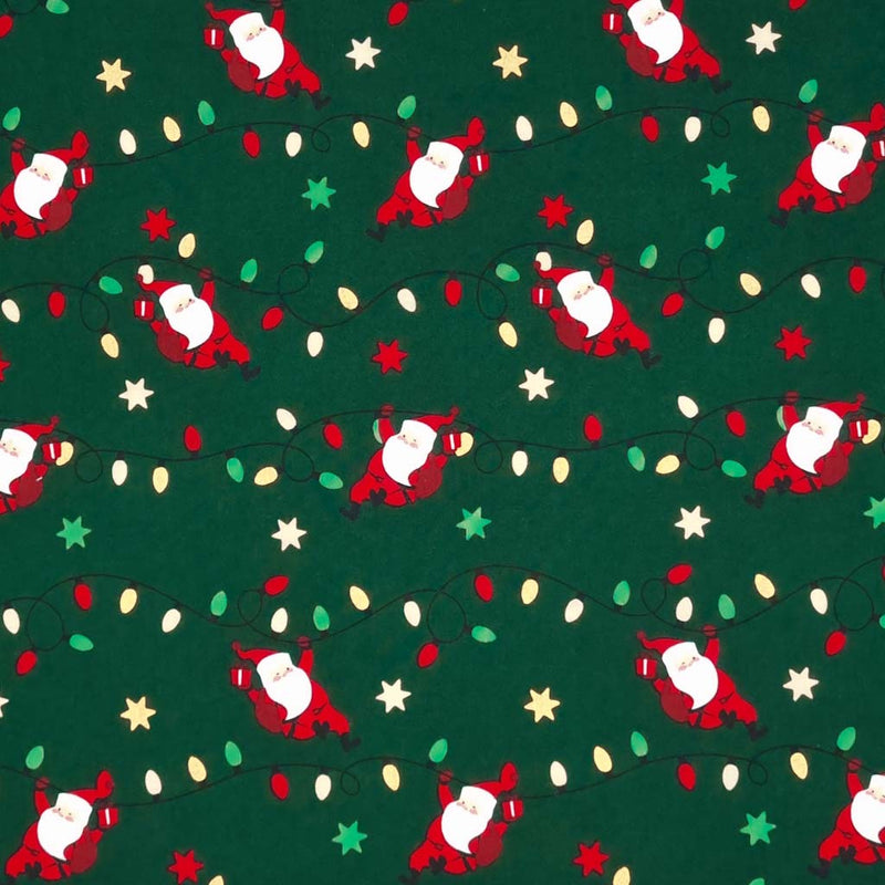 Santa holding strings of fairy lights printed on a green christmas cotton fabric