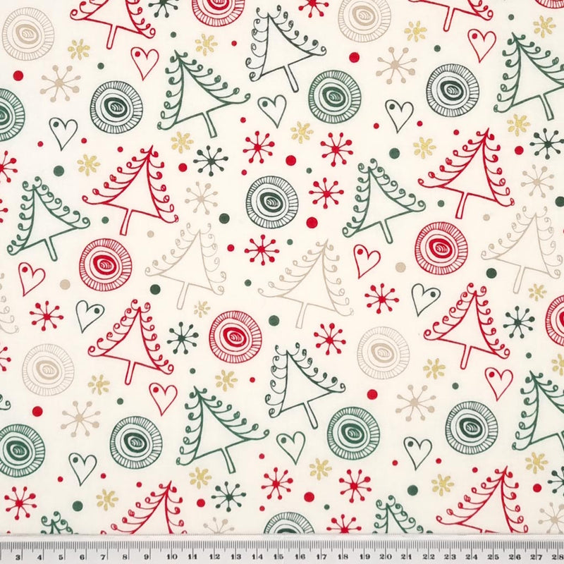 Swirly red and green chrismas trees printed on an ivory cotton fabric with a cm ruler at the bottom