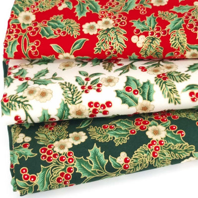 a traditional festive bundle of 3 cotton fabrics with gold metallic design features. The prints include a holly flower in red, green and ivory colourways