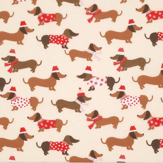 Dachshund sausage dogs in christmas jumpers printed on a cream polycotton fabric