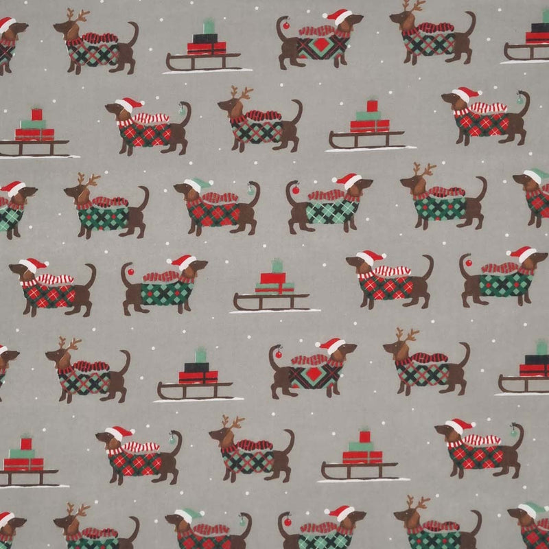 cute dachshund sausage dogs wearing Christmas jumpers and sledges laden with gifts are printed on a silver polycotton fabric