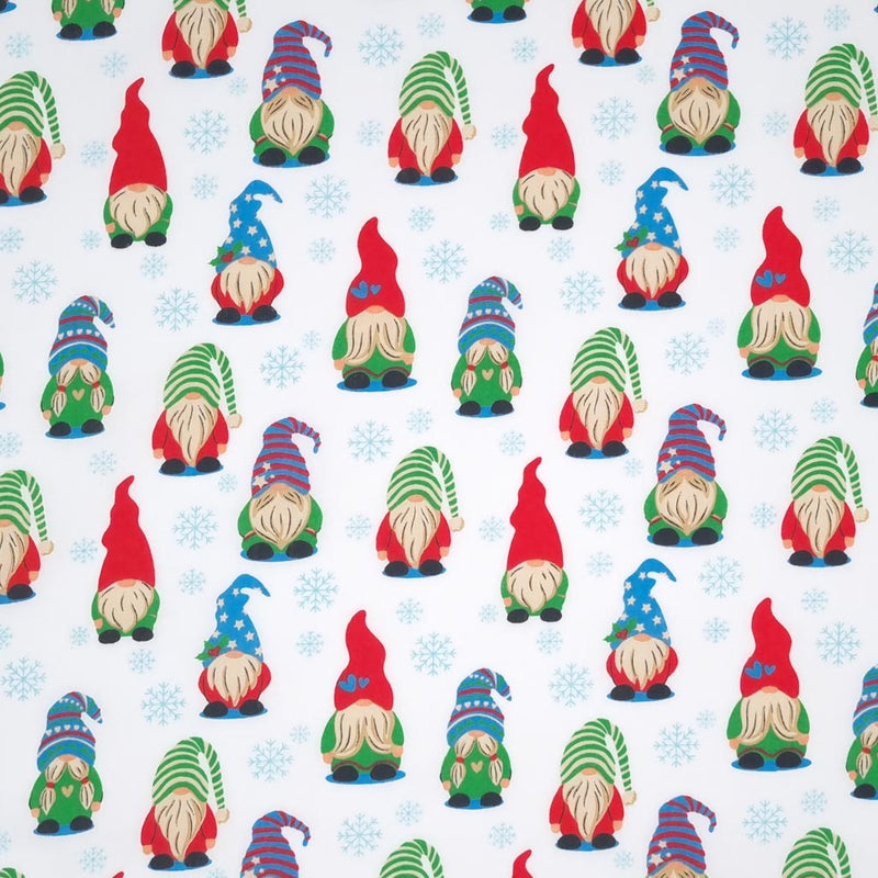 Brightly coloured gonks in a snowy scene printed on a polycotton fabric