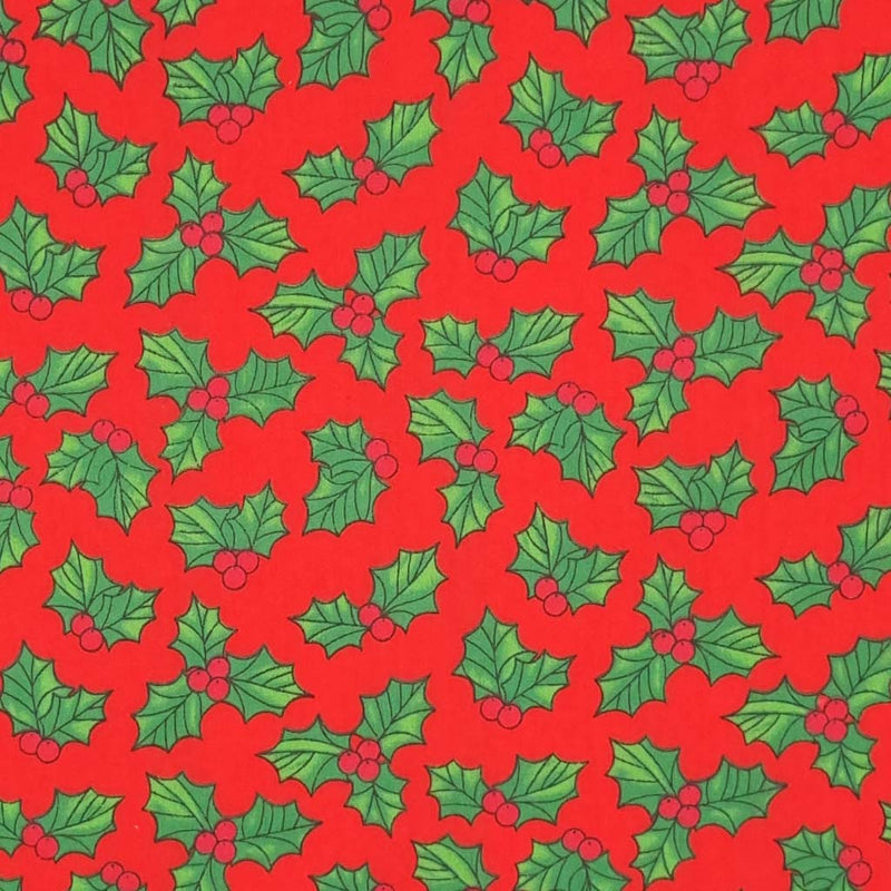 Festive holly leaves and berries printed on a red background. 
